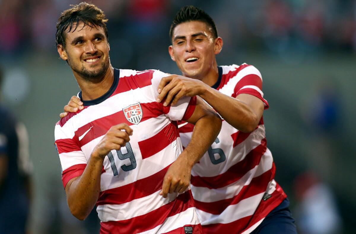 U.S. forward Chris Wondolowski celebrates with teammate Joe Corona after scoring his third goal against Belize during a CONCACAF Gold Cup game in Portland, Ore., earlier this year.