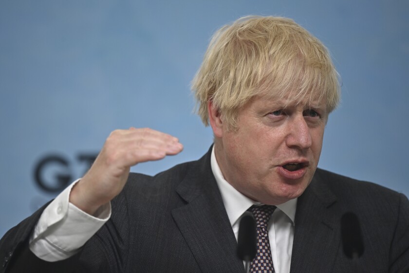 Britain's Prime Minister Boris Johnson gestures, during a press conference on the final day of the G7 summit in Carbis Bay, Cornwall, England, Sunday June 13, 2021. (Ben Stansall/Pool Photo via AP)