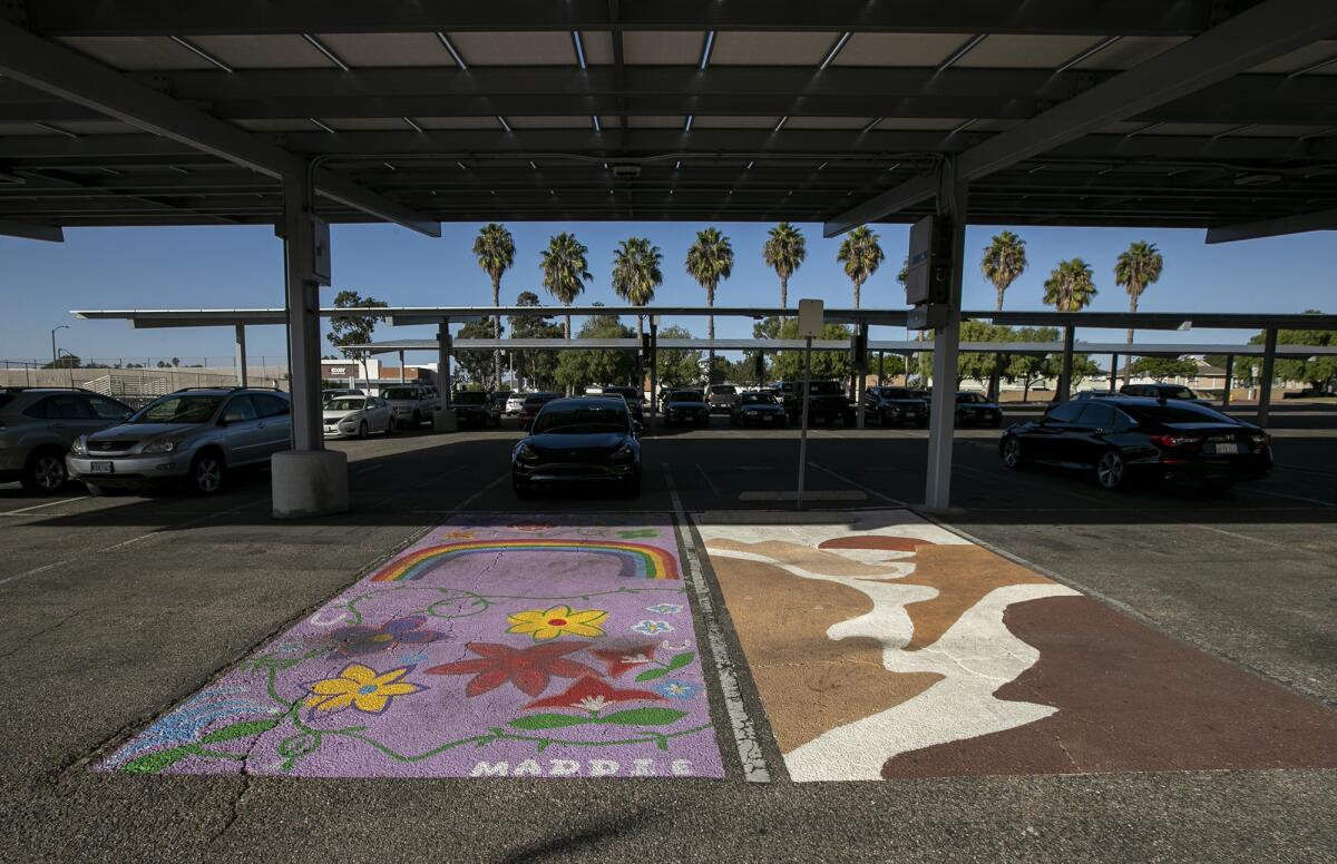 Art-filled parking spaces adorn the lot in front of Ocean View High School on Thursday in Huntington Beach.
