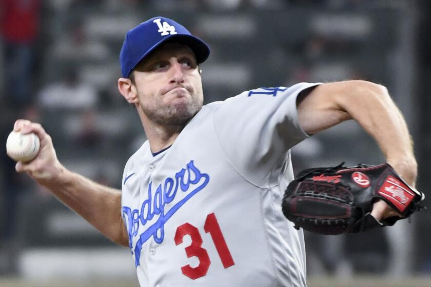 Atlanta, GA - October 17: Los Angeles Dodgers starting pitcher Max Scherzer delivers a pitch during the third inning.