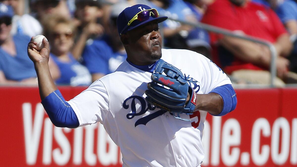 Dodgers third baseman Juan Uribe throws to second base during an exhibition game against the Seattle Mariners on March 6.