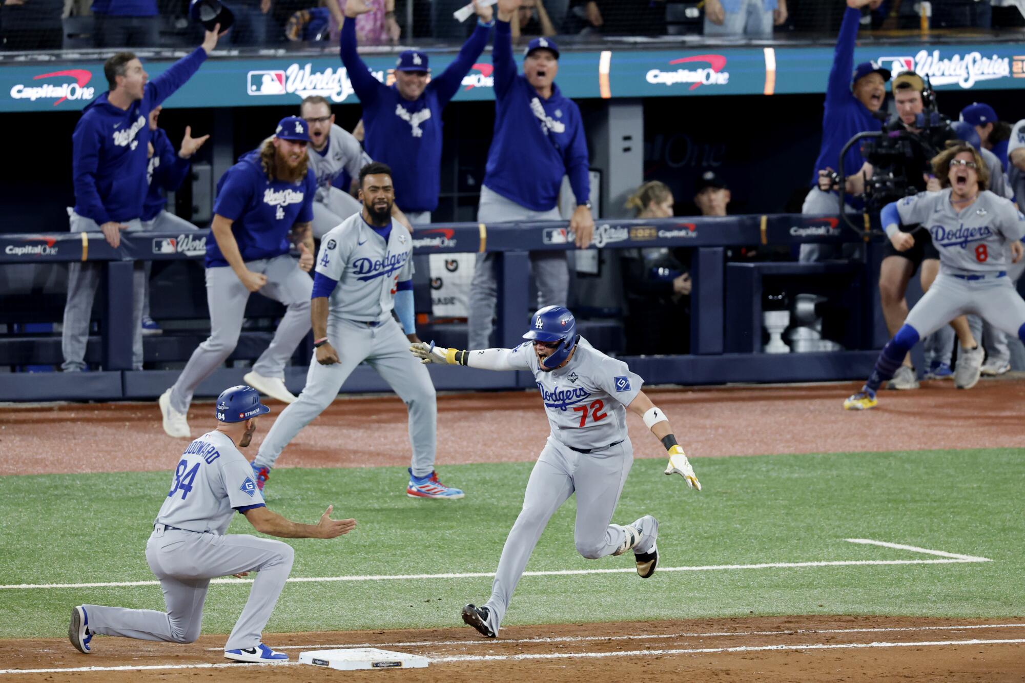 In a World Sequence finale for the ages, Dodgers cement their dynasty in win over Blue Jays 1 Miguel Rojas celebrates after tying the game on a solo home run in the ninth inning.