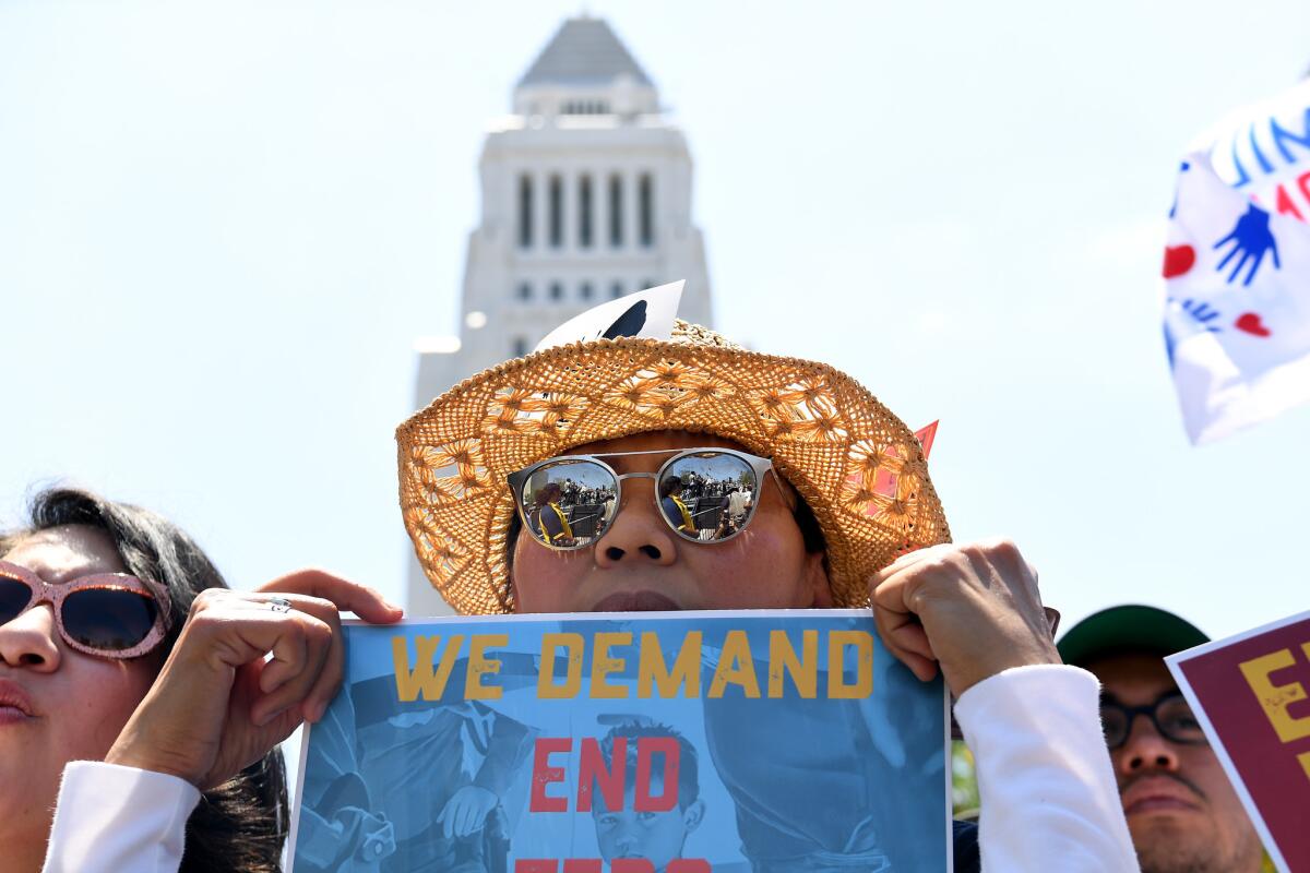LOS ANGELES: Protestors listen to a speeches during a downtown L.A. rally.