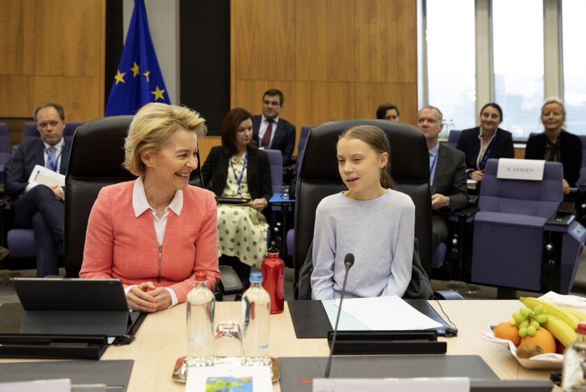 European Commission President Ursula von der Leyen is joined by climate activist Greta Thunberg during the weekly meeting of college of EU commissioners March 4 in Brussels.
