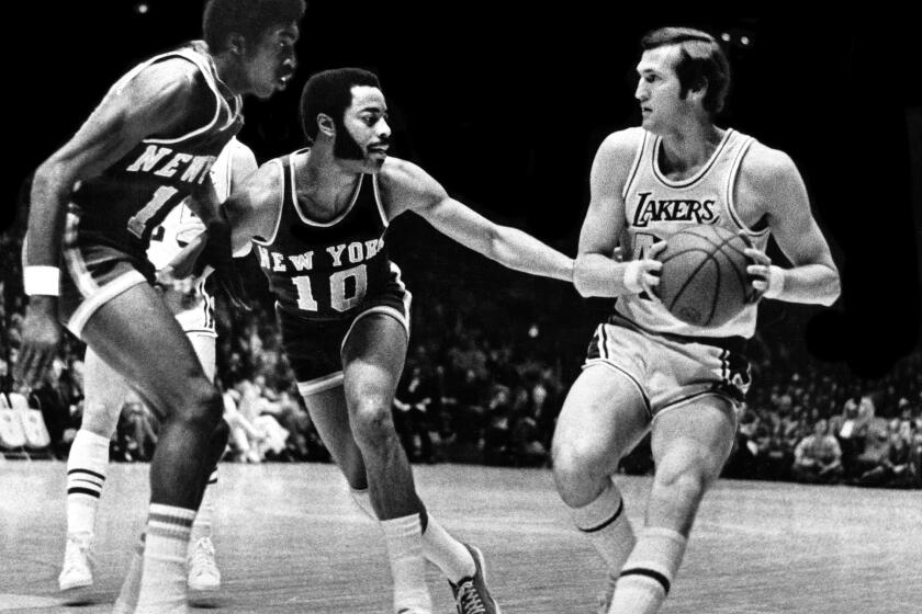NOV 2, 1973 – Lakers' Jerry West finds two Knicks, Earl Monroe and Walt Frazier (10) cutting him off during tonight's NBA game at the Forum. West scored 32 points as Lakers won.