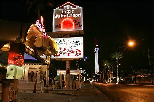 The neon lights advertise the multitude of wedding chapels along Las Vegas Boulevard.