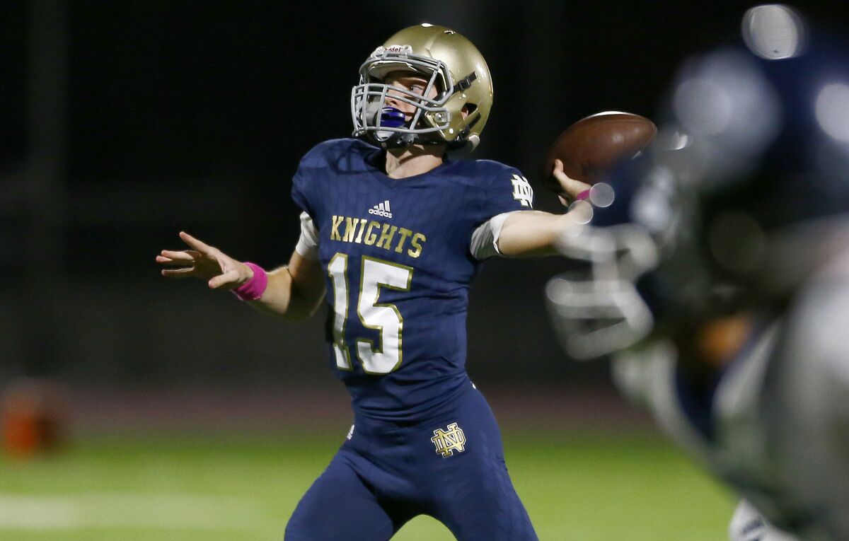 Sherman Oaks Notre Dame quarterback Zachary Siskowic throws a touchdown pass during the first quarter of a 29-23 victory over Loyola on Friday.