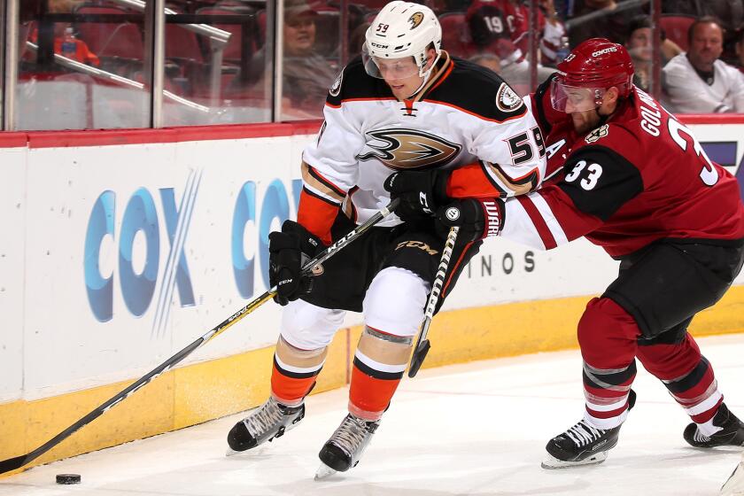 Ducks winger Nick Sorensen tries to elude Coyotes defenseman Alex Goligoski with the puck during the second period Saturday.