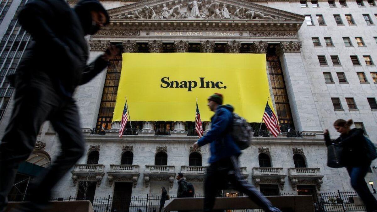 A Snap banner adorns the front of the New York Stock Exchange in 2017, shortly before the company's IPO.