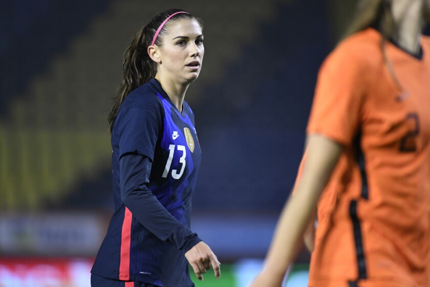 FILE - In this Nov. 27, 2020, file photo, United States Alex Morgan reacts during the international friendly women's soccer match agaiinst The Netherlands at Rat Verlegh stadium in Breda, southern Netherlands. Morgan is back with the U.S. national team and learning to adjust to a career as a working mom. (Piroschka van de Wouw/Pool via AP, File)