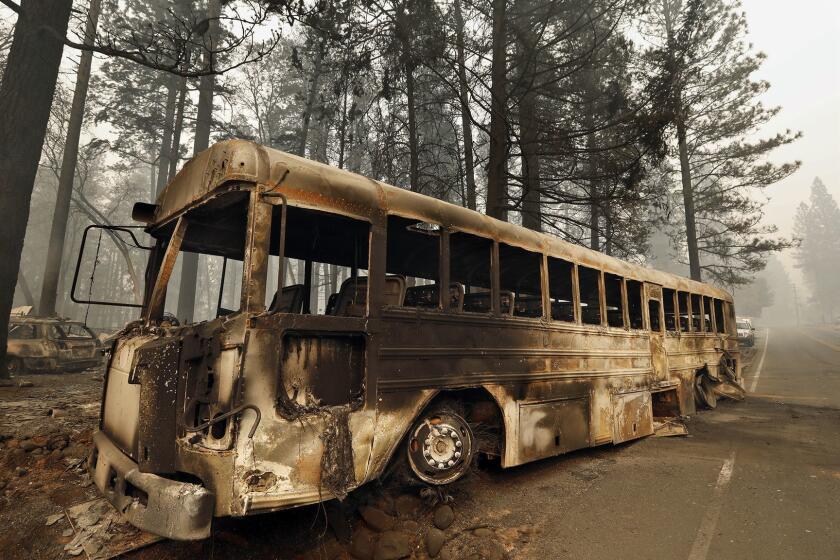 PARADISE, CALIFORNIA--NOV. 11, 2018-The bus that many people had to abandon in order to make it out of the Camp fire, on Skyline Dr. in Paradise, CA. (Carolyn Cole/Los Angeles Times)