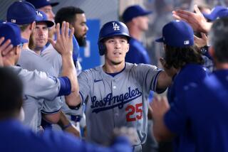 Anaheim, California September 3, 2024-Dodgers Tommy Edman celebrates after scoring a run against the Angels at Anaheim Stadium Tuesday. (Wally Skalij/Los Angeles Times)