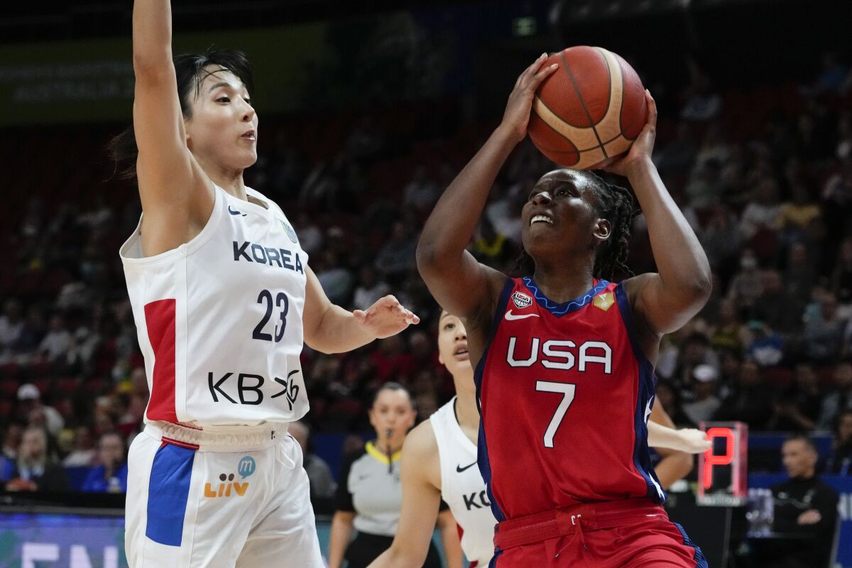 United States' Ariel Atkins shoots at goal as South Korea's Kim Danbi , left, attempts to block during their game at the women's Basketball World Cup in Sydney, Australia, Monday, Sept. 26, 2022. (AP Photo/Mark Baker)