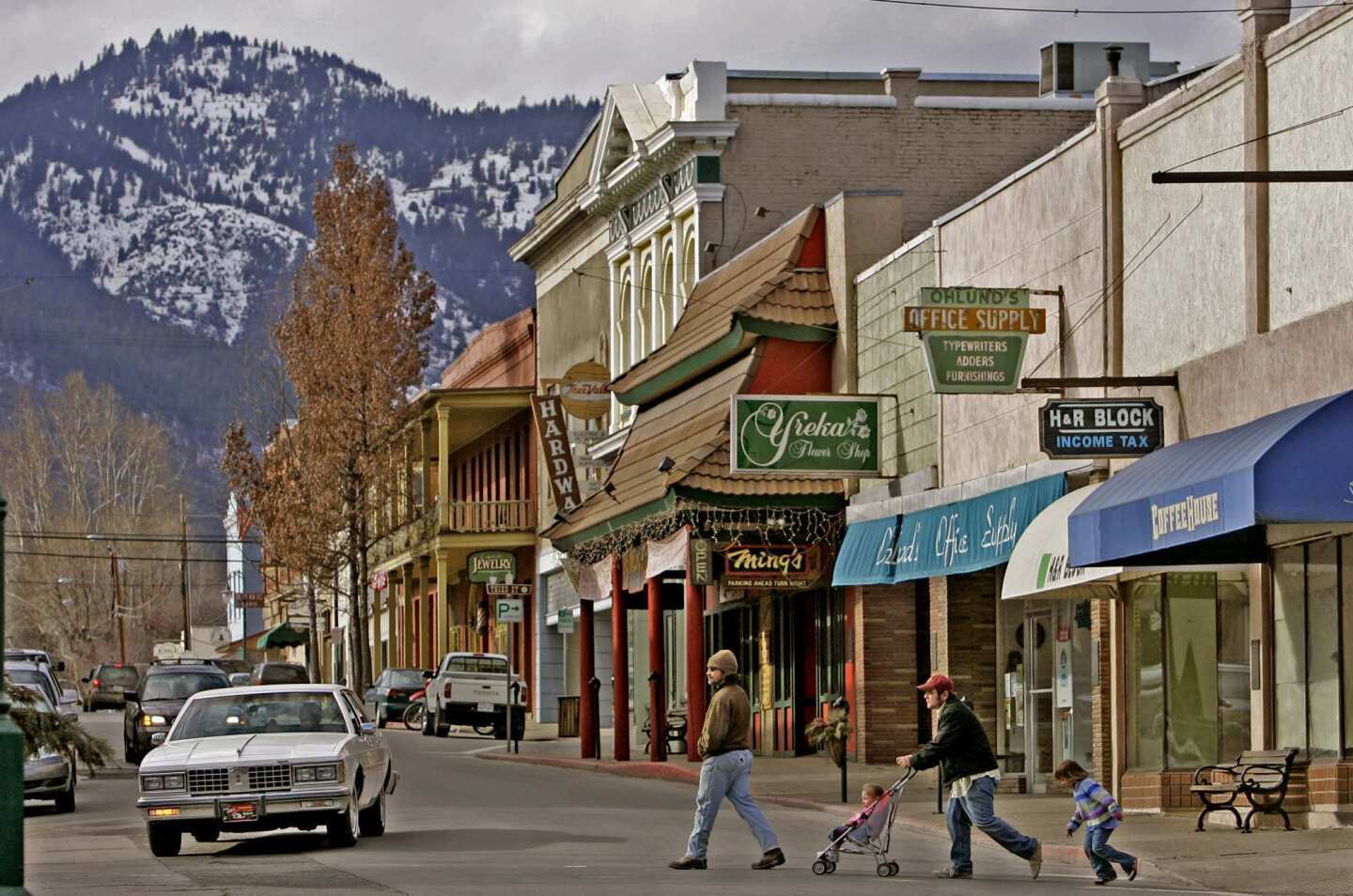 Pedestrians cross Miner Street in Yreka, a town of about 8,000 with Western-style architecture and turn-of-the-last-century homes.