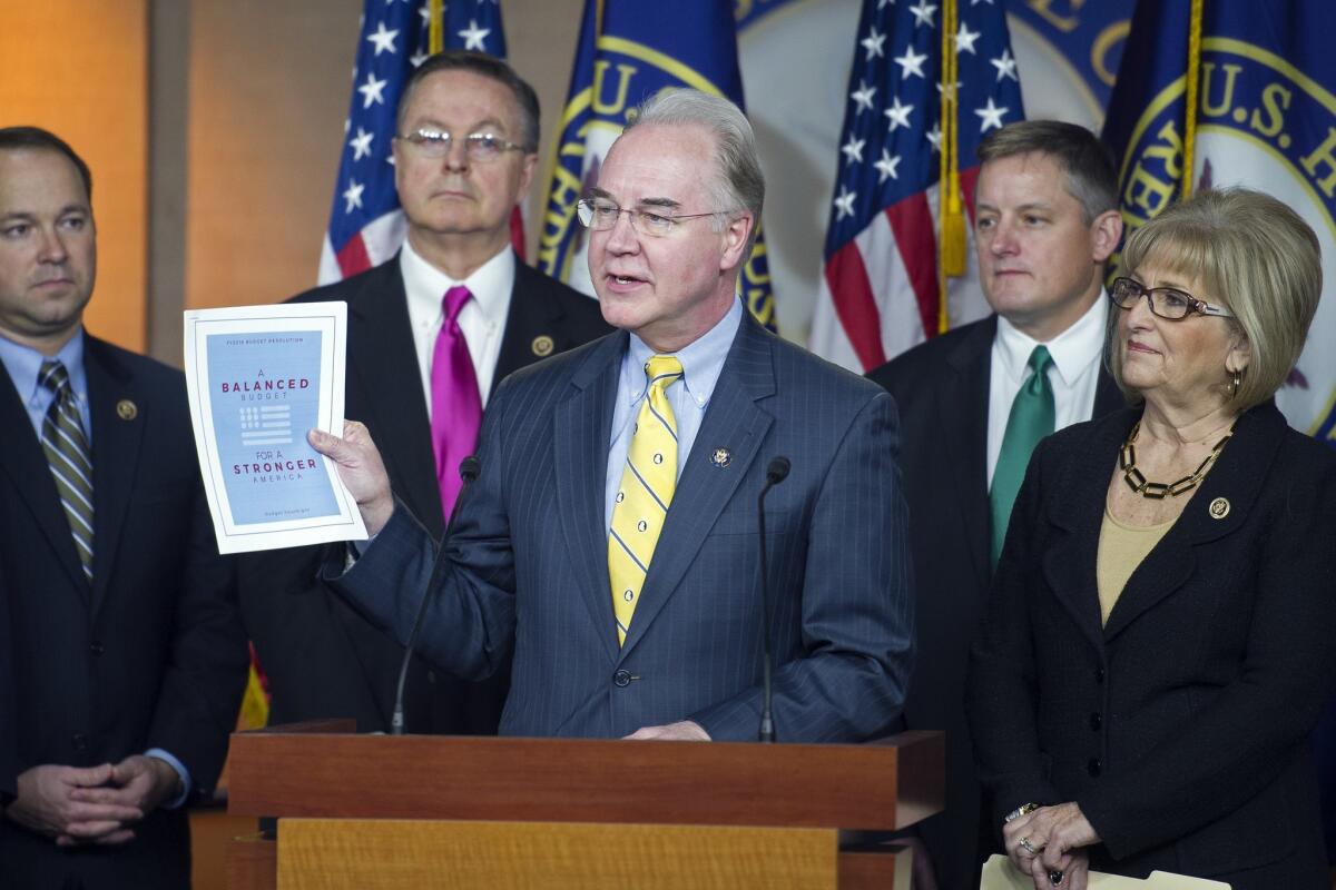 House Budget Committee Chairman Rep. Tom Price (R-Ga.) holds up a synopsis of the House Republican budget proposal as he announces the plan on Capitol Hill in Washington.