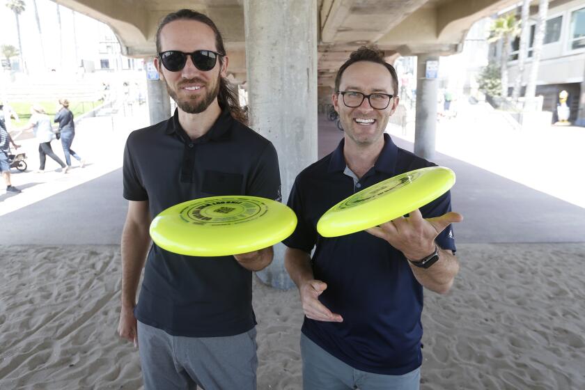 Jacob Walsh, president of OC Ultimate, and tournament director Grant Boyd, from left, look forward to the 2023 USA Ultimate Beach National Championships tournament to be held on the weekend of May 14th in Huntington Beach.