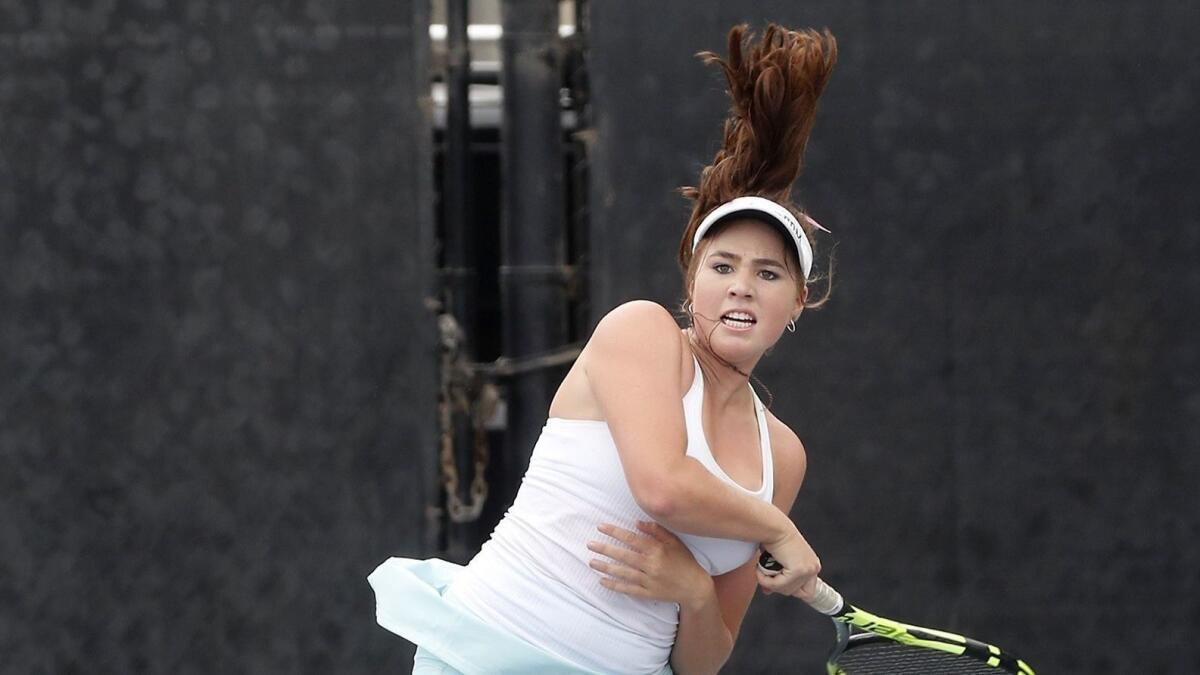 Corona del Mar High's Roxy Mackenzie competes in a No. 3 singles set against Manhattan Beach Mira Costa during a nonleague match on Wednesday.