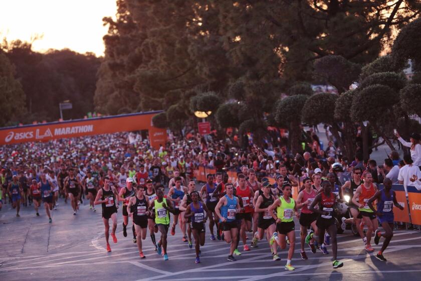 Elite runners take off at the start of the 30th L.A. Marathon at Dodger Stadium, in Los Angeles, Calif., on Mar. 15, 2015.
