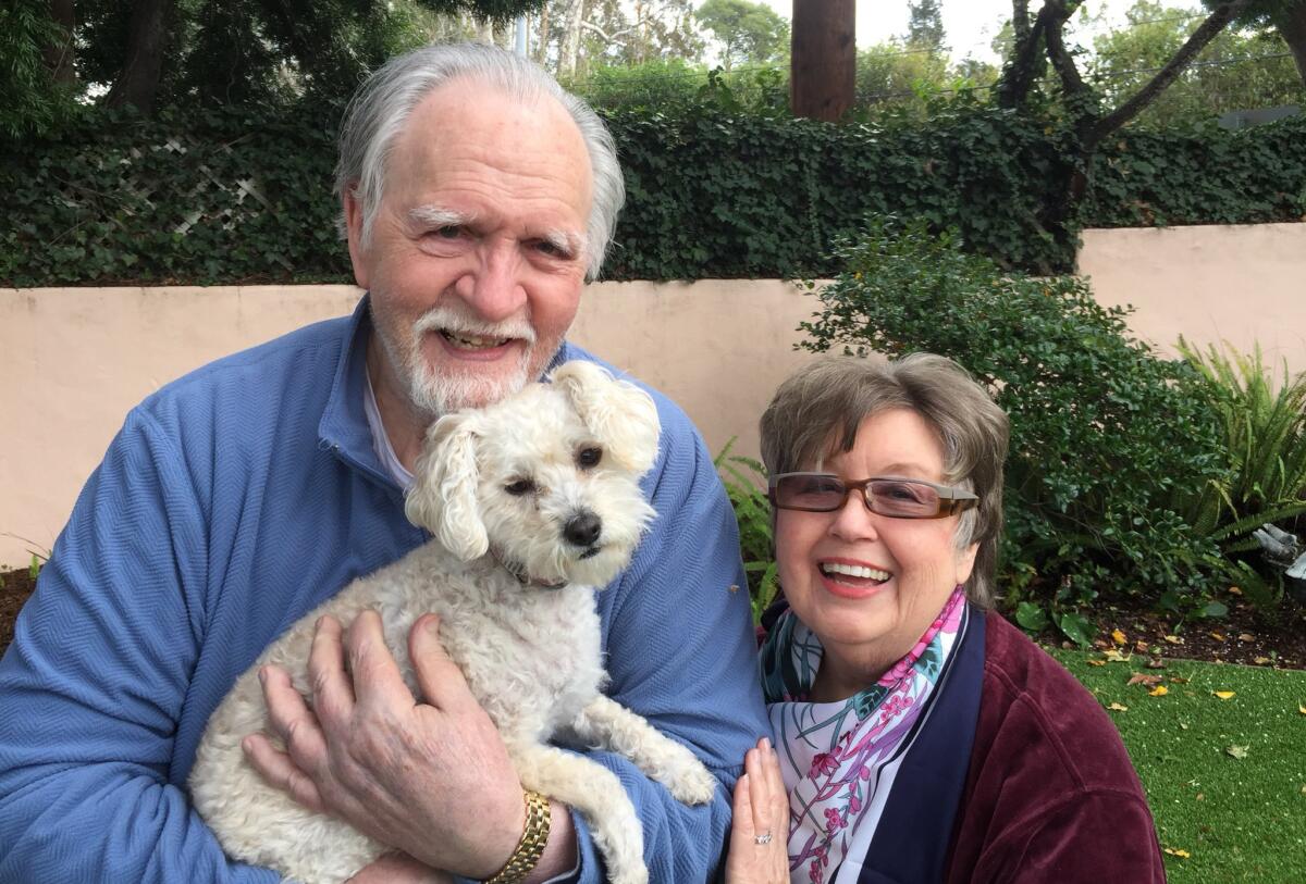 Jim and Alice Mitchell with their dog, Gigi.