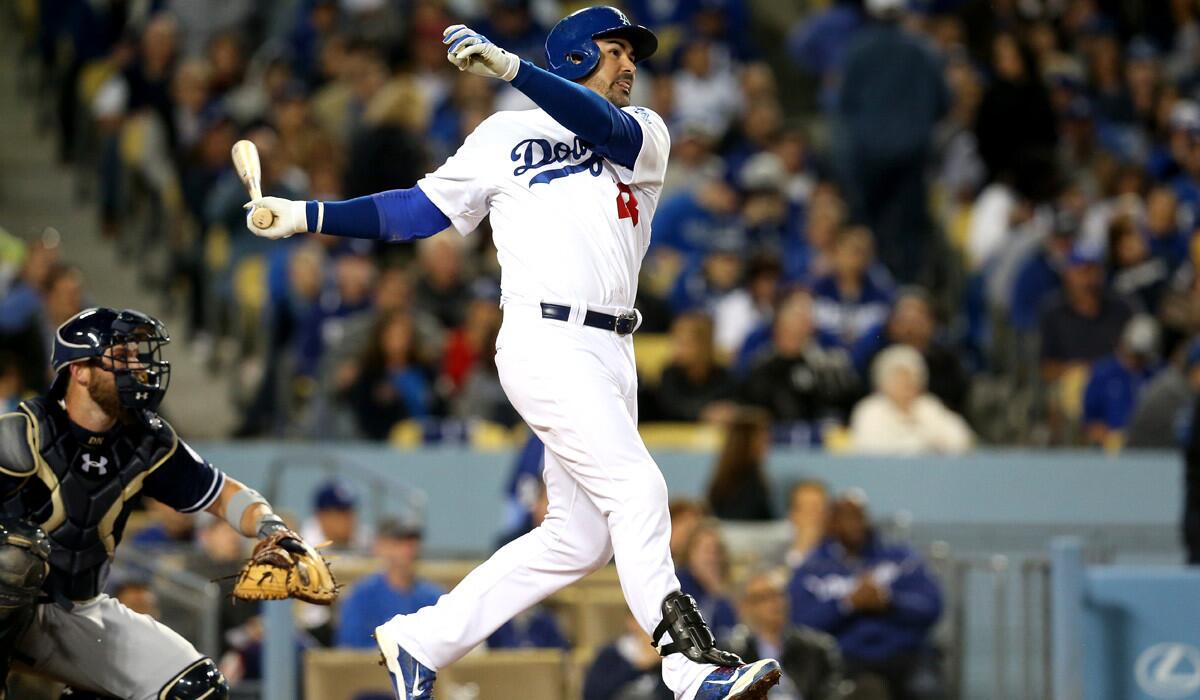 Dodgers' Adrian Gonzalez hits his second home run of the game during a 7-4 win over the San Diego Padres on Wednesday.