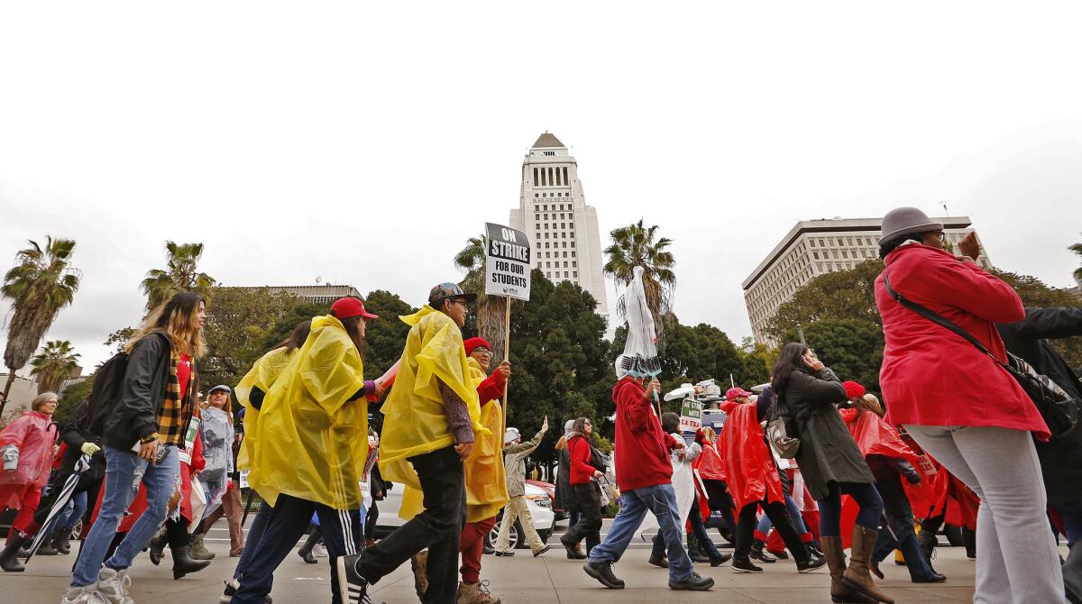 Teachers and supporters make their way through downtown Los Angeles on the second day of the teachers' strike on Jan. 15.