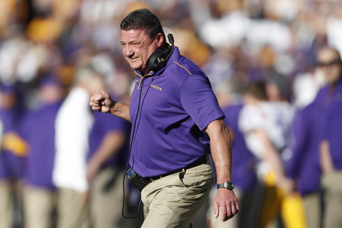 Louisiana State coach Ed Orgeron reacts after a Tigers touchdown in the first half against Alabama on Saturday.