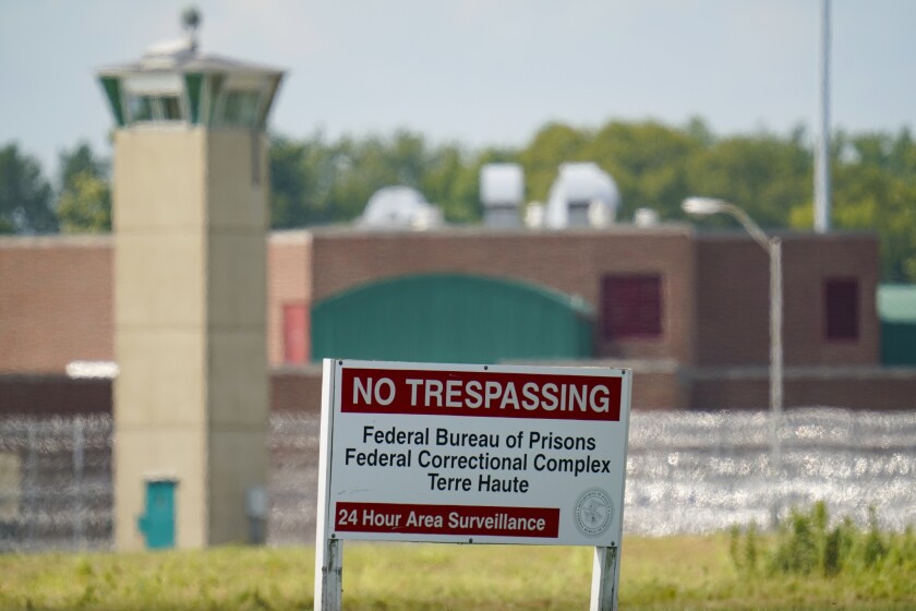 FILE - In this Aug. 26, 2020 file photo, the federal prison complex in Terre Haute, Ind., is shown Wednesday, Aug. 26, 2020. Dozens of civil rights and advocacy organizations are calling on the Biden administration to immediately halt federal executions after an unprecedented run of capital punishment under President Donald Trump. They want President Joe Biden to commute the sentences of inmates on federal death row. (AP Photo/Michael Conroy)