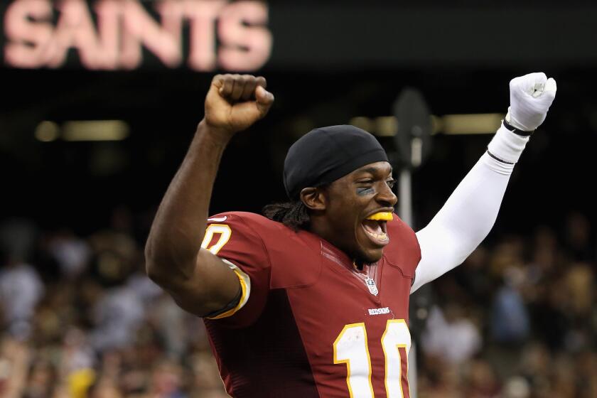 Robert Griffin III celebrates the Redskins' victory Sunday.