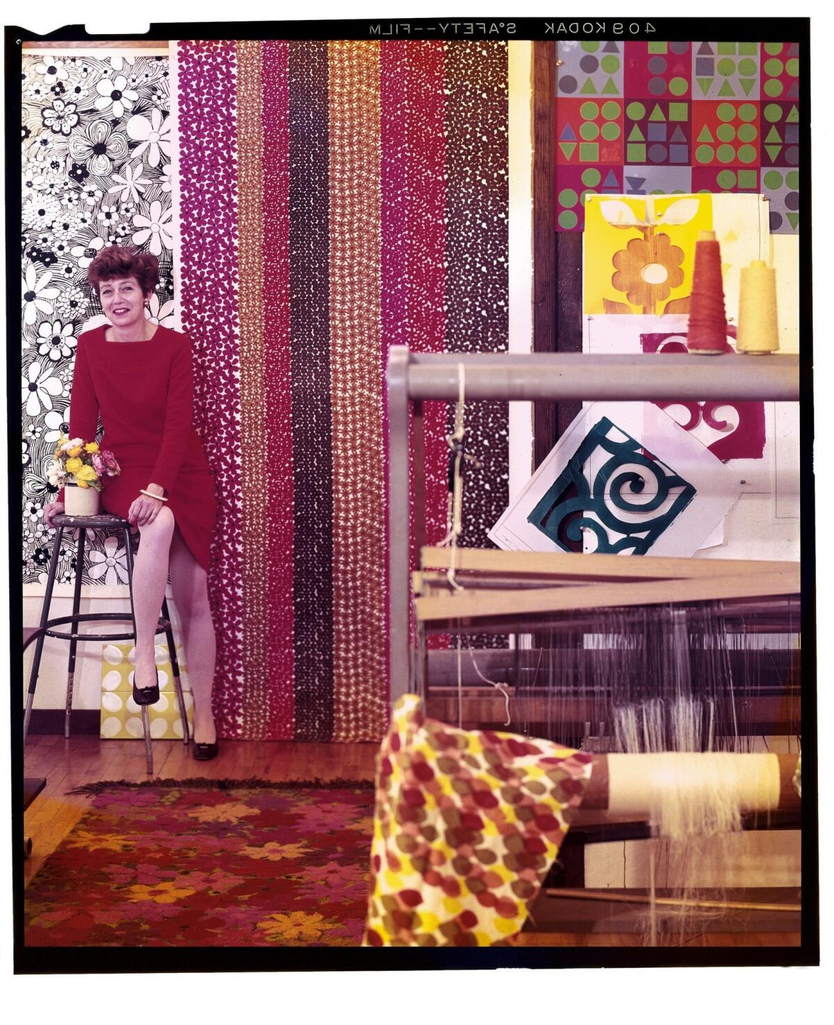 In a photo taken for the Los Angeles Times Home magazine in 1967, Gere Kavanaugh is surrounded by her colorful fabric designs.