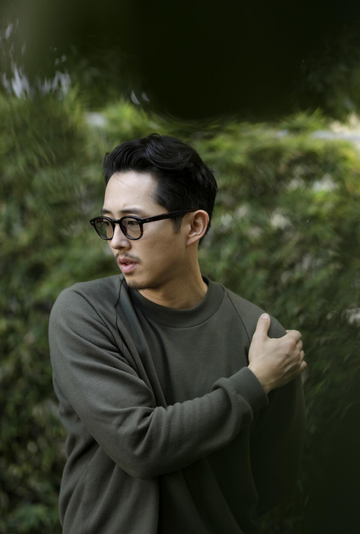 Steven Yeun, above, has a "mysterious duality," says "Burning" director Lee Chang-dong.