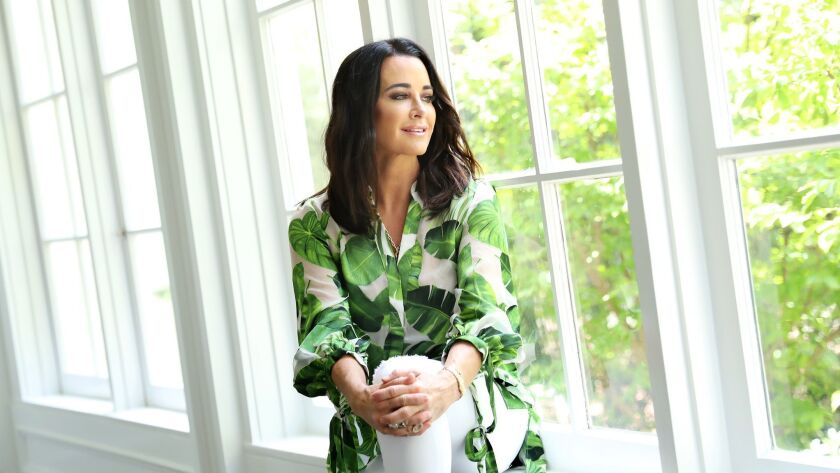 "The Real Housewives of Beverly Hills" star Kyle Richards, shown at her home, is stepping out of her reality TV shell with a new scripted series, "American Woman, " which is inspired by her childhood.