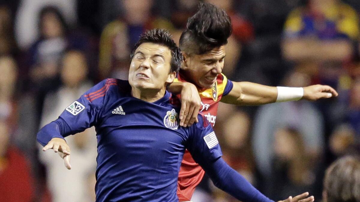 Chivas USA forward Erick Torres, front, and Real Salt Lake defender Carlos Salcedo try to head the ball during the first half of Chivas USA's 2-0 loss Wednesday.