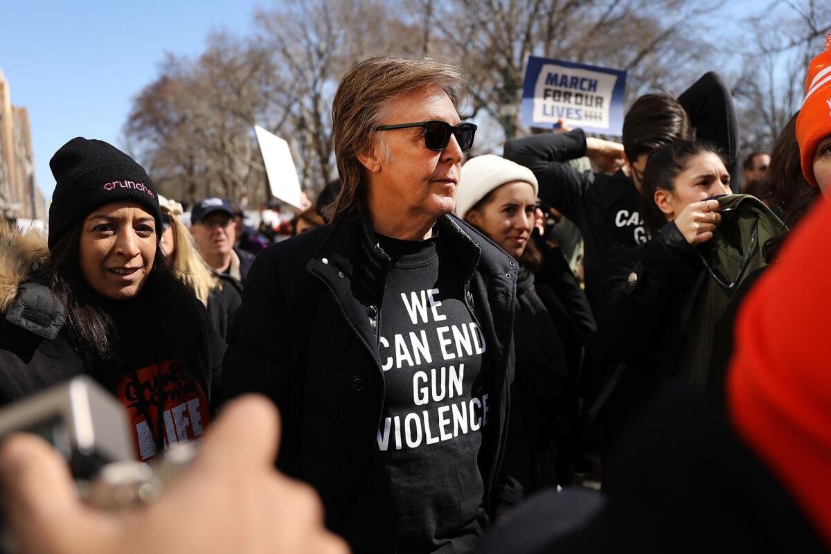 Paul McCartney joins thousands of people in Manhattan during the March for Our Lives rally in New York.