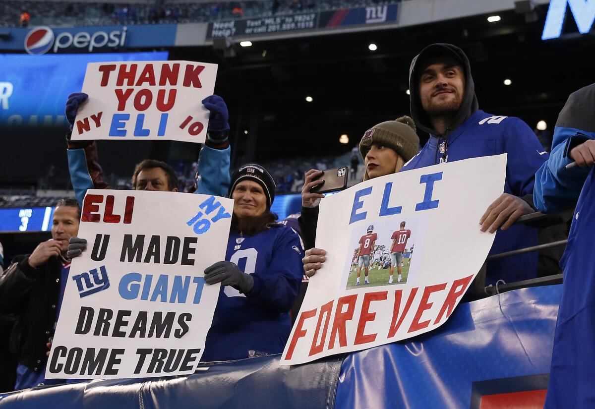 Fans at MetLife Stadium show their appreciation for Eli Manning as the New York Giants walk off the field following a win over the Miami Dolphins.
