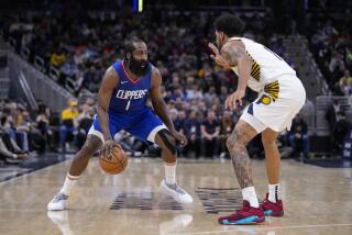 Clippers guard James Harden drives on Indiana Pacers forward Obi Toppin.