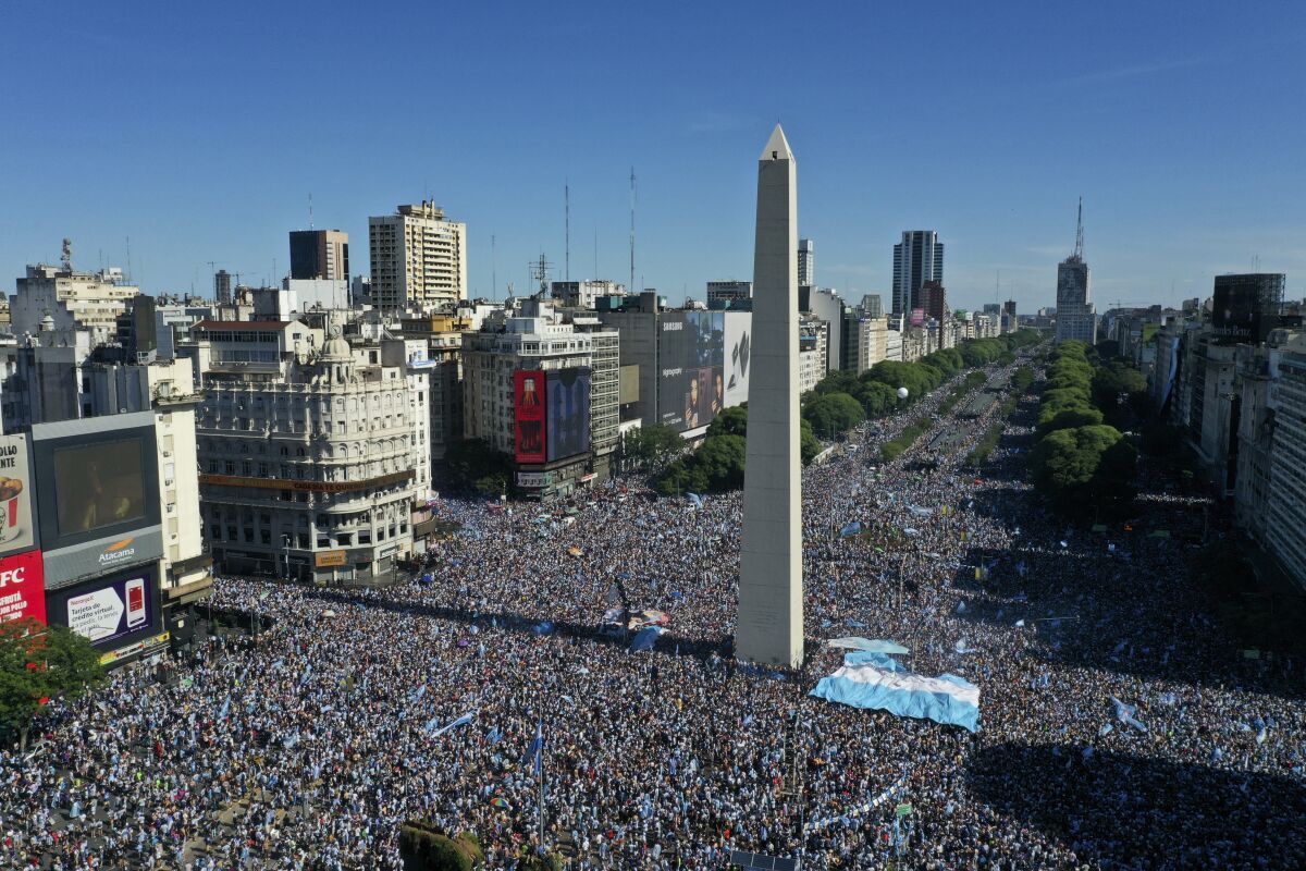 Argentine soccer fans celebrate their team's World Cup victory over France in Buenos Aires, Argentina on Sunday.