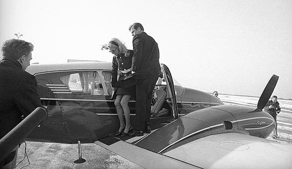 Kennedy and wife Joan leave a chartered plane on Martha's Vineyard on their way to the inquest into the death of Mary Jo Kopechne.