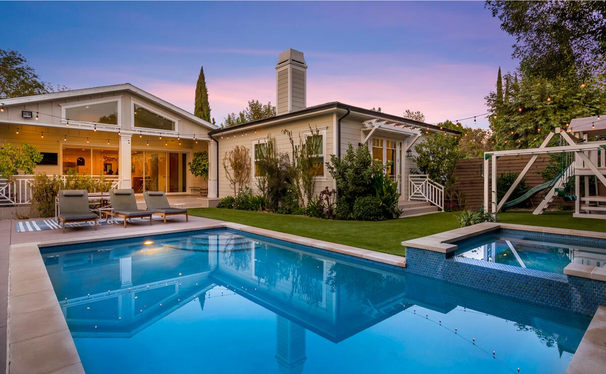 The single-story home includes a private backyard with a swimming pool, spa and playground.