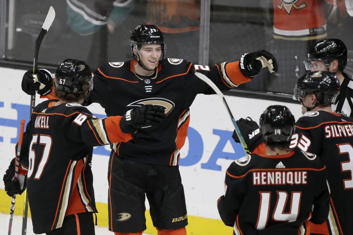 Ducks defenseman Christian Djoos  celebrates scoring against the Minnesota Wild with teammates during the third period at the Honda Center on March 8.