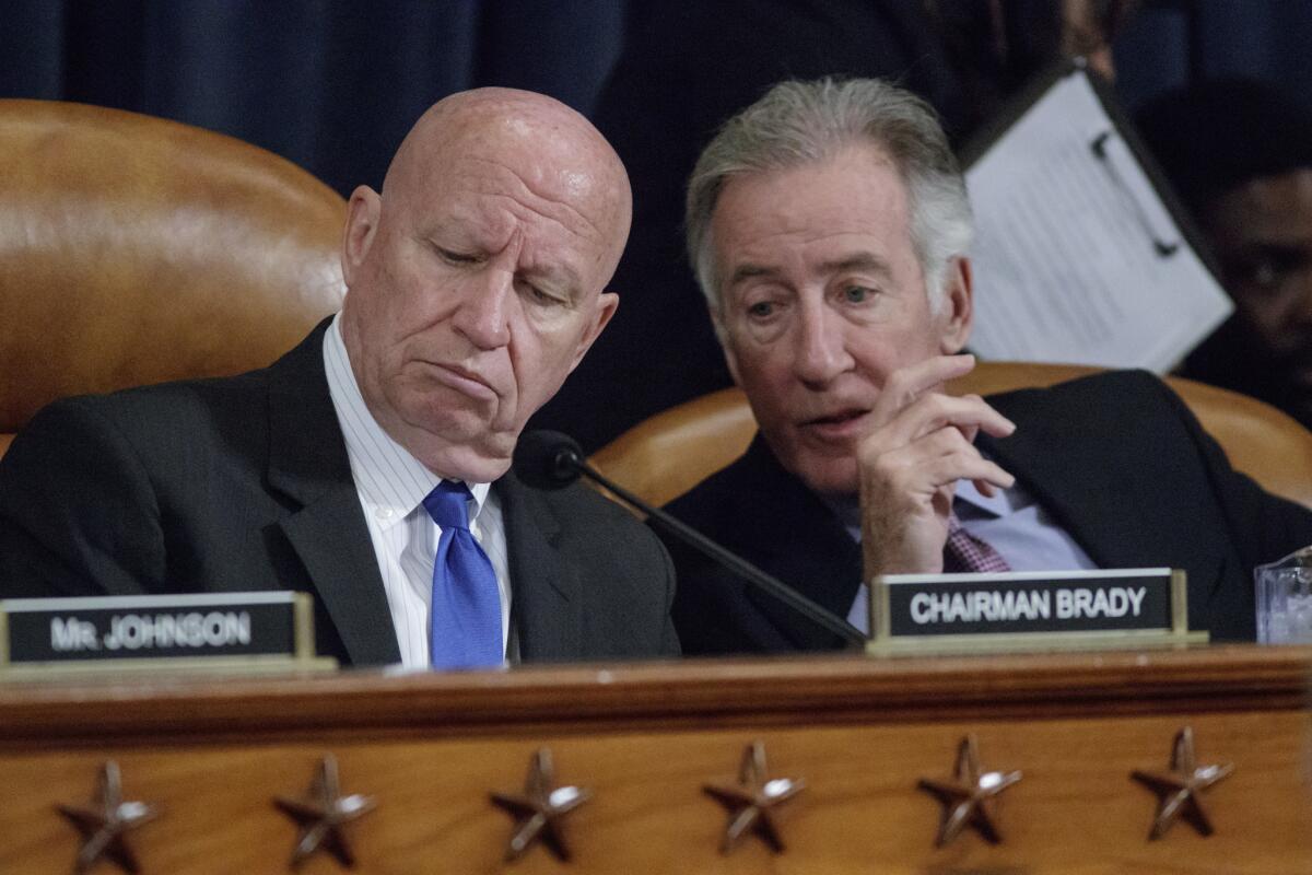 House Ways and Means Committee Chairman Rep. Kevin Brady (R-Texas), left, listens to the committee's ranking member, Rep. Richard E. Neal (D-Mass.) in Washington on Wednesday.