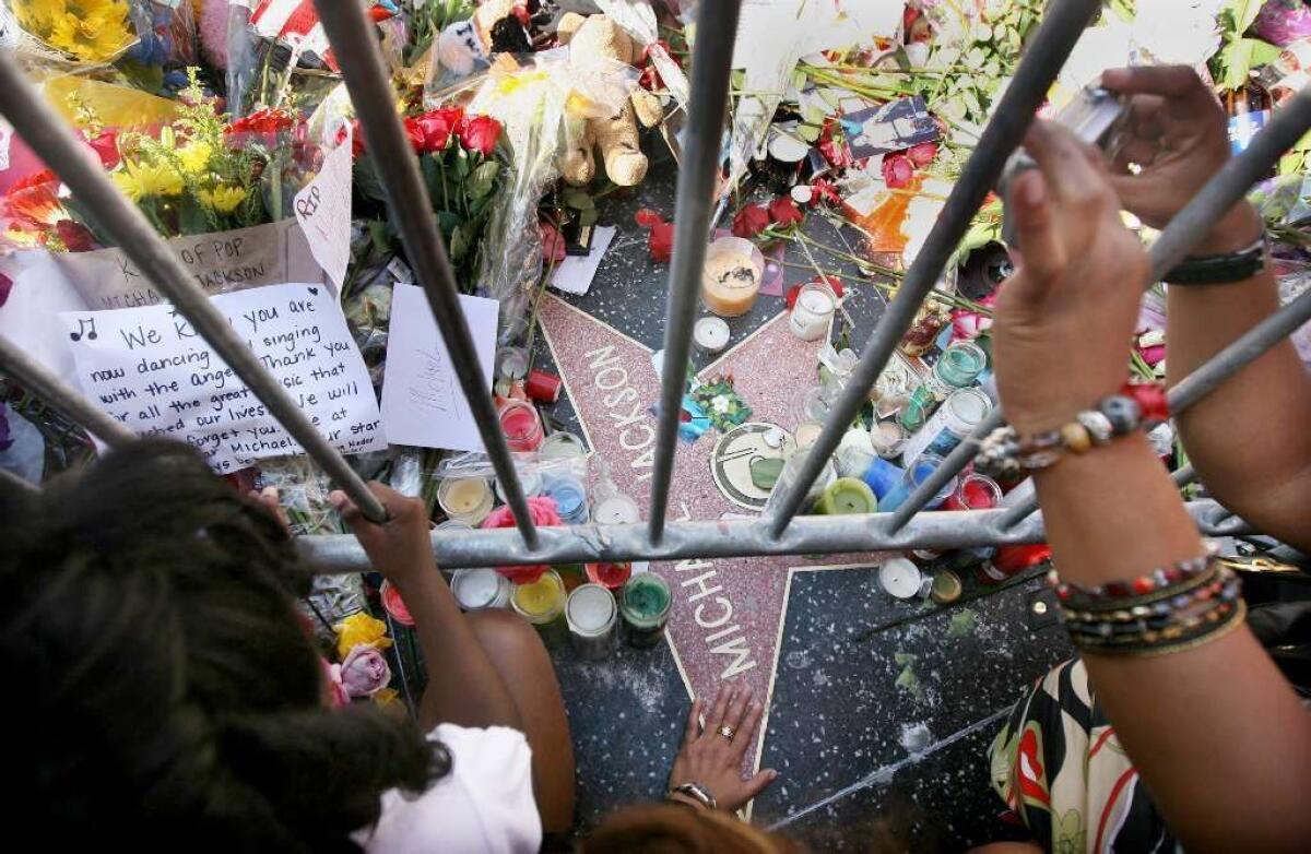 Fans visit Michael Jackson’s star on Hollywood Boulevard in Hollywood on June 27, 2009.