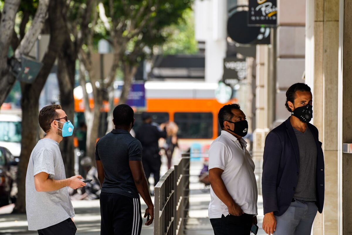People wearing masks in downtown L.A. last month.
