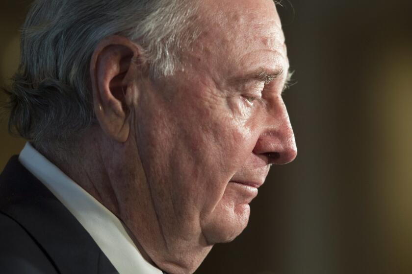 Former Canadian Prime Minister Paul Martin speaks with the media about former federal Cabinet minister and political commentator Jean Lapierre in Ottawa.