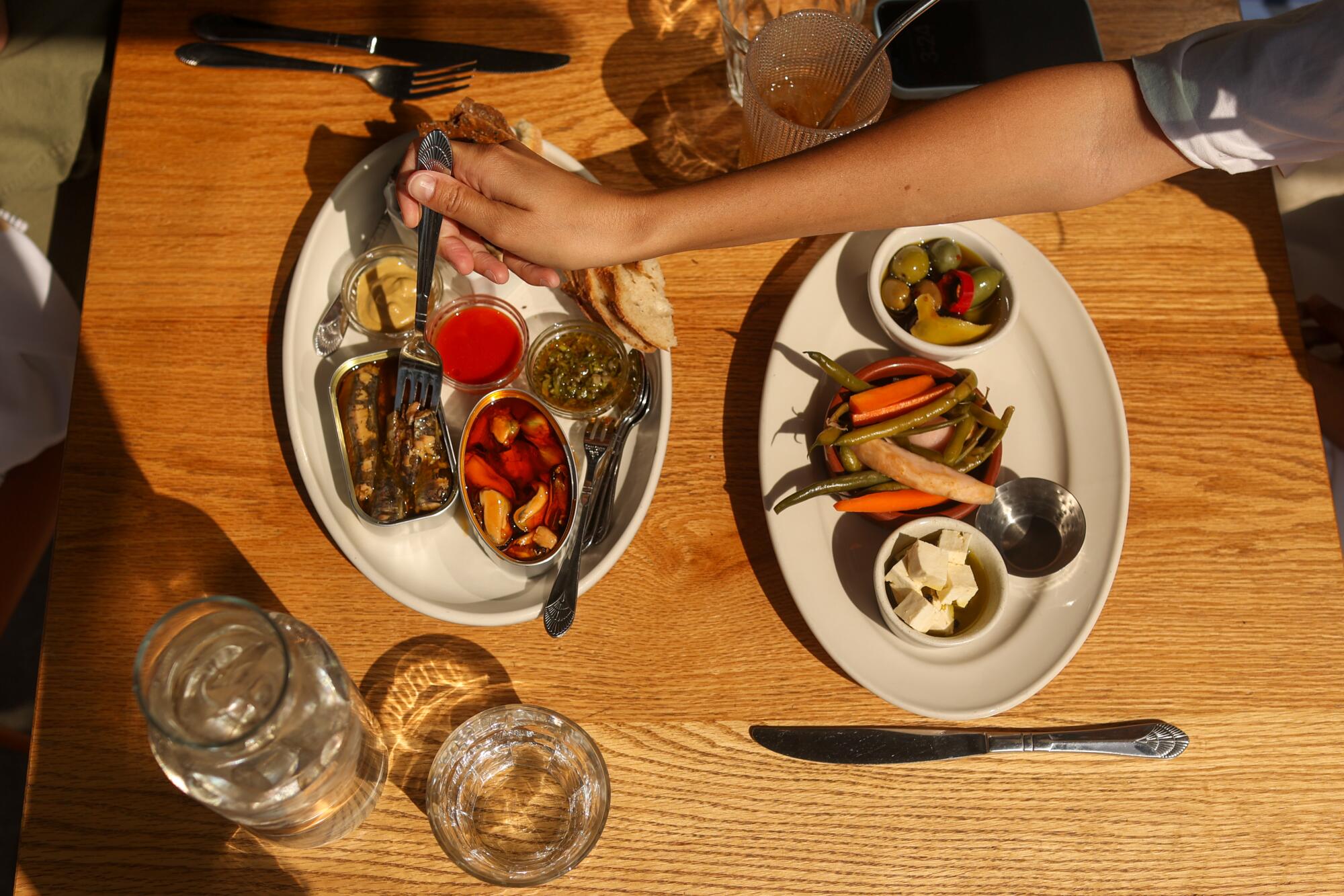 A spread of food on a wooden table.