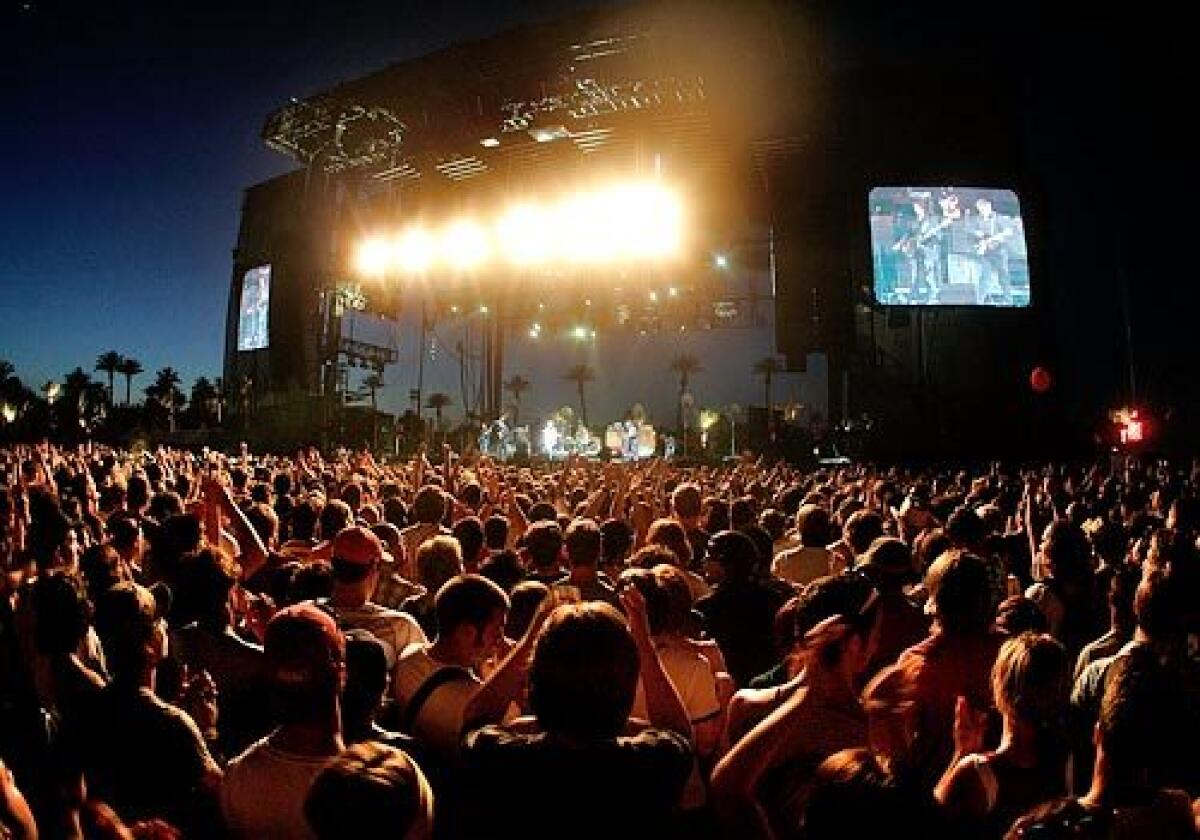 Fans fill the lawn in front of the main stage during a performance by the Jesus and Mary Chain on Friday evening.