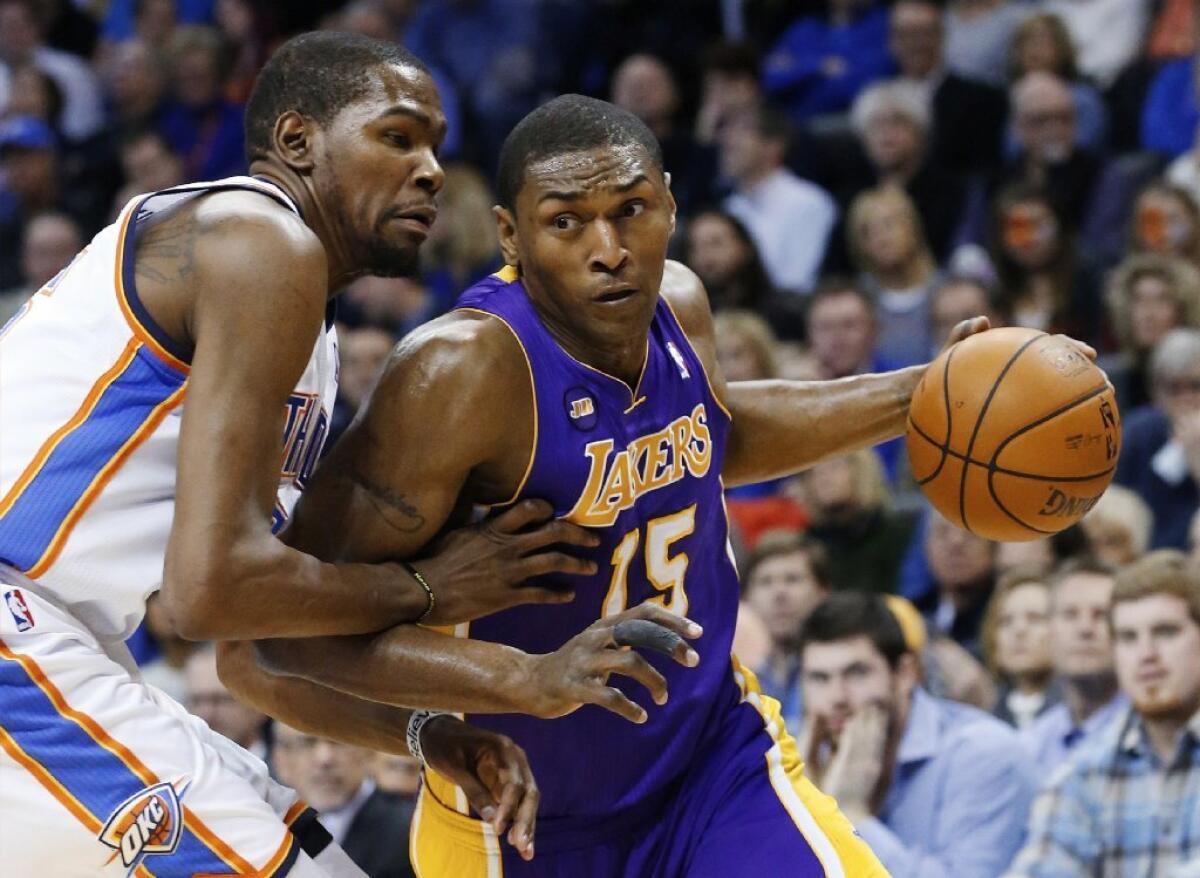 Metta World Peace agreed to a two-year deal with the New York Knicks. Above, he drives by Kevin Durant in a Lakers-Thunder game in March.