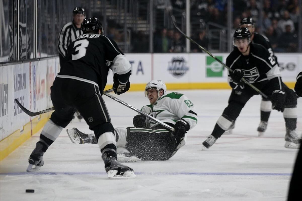 Dallas Stars winger Ales Hemsky is knocked to the ice as he advances the puck past Kings defenseman Brayden McNabb during the first period of a game on Jan. 19.