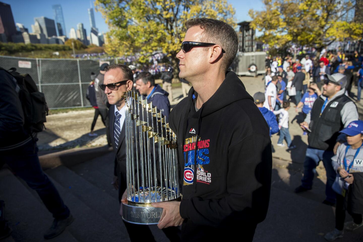 Chicago Cubs' Ben Zobrist holds the World Series MVP Trophy as he arrives  on stage during the 2016 World Series Champion celebration rally at the  Grant Park on November 4, 2016 in