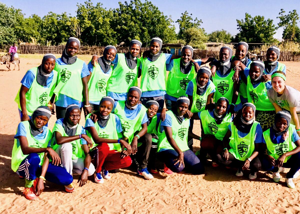 Players gather during the launch of the Darfur United women's team 