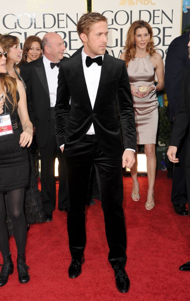 Ryan Gosling in a black velvet suit by Ferragamo, white shirt with pearl buttons by Lavin, black velvet tie by Hugo Boss and black patent leather Ferragamo shoes.